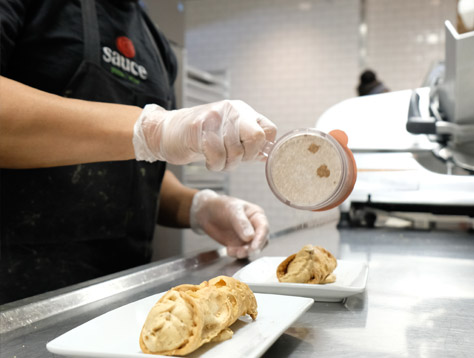 Sauce Team Member preparing food