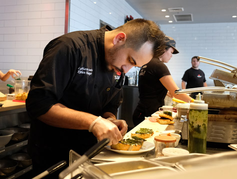 Sauce Team Members preparing food